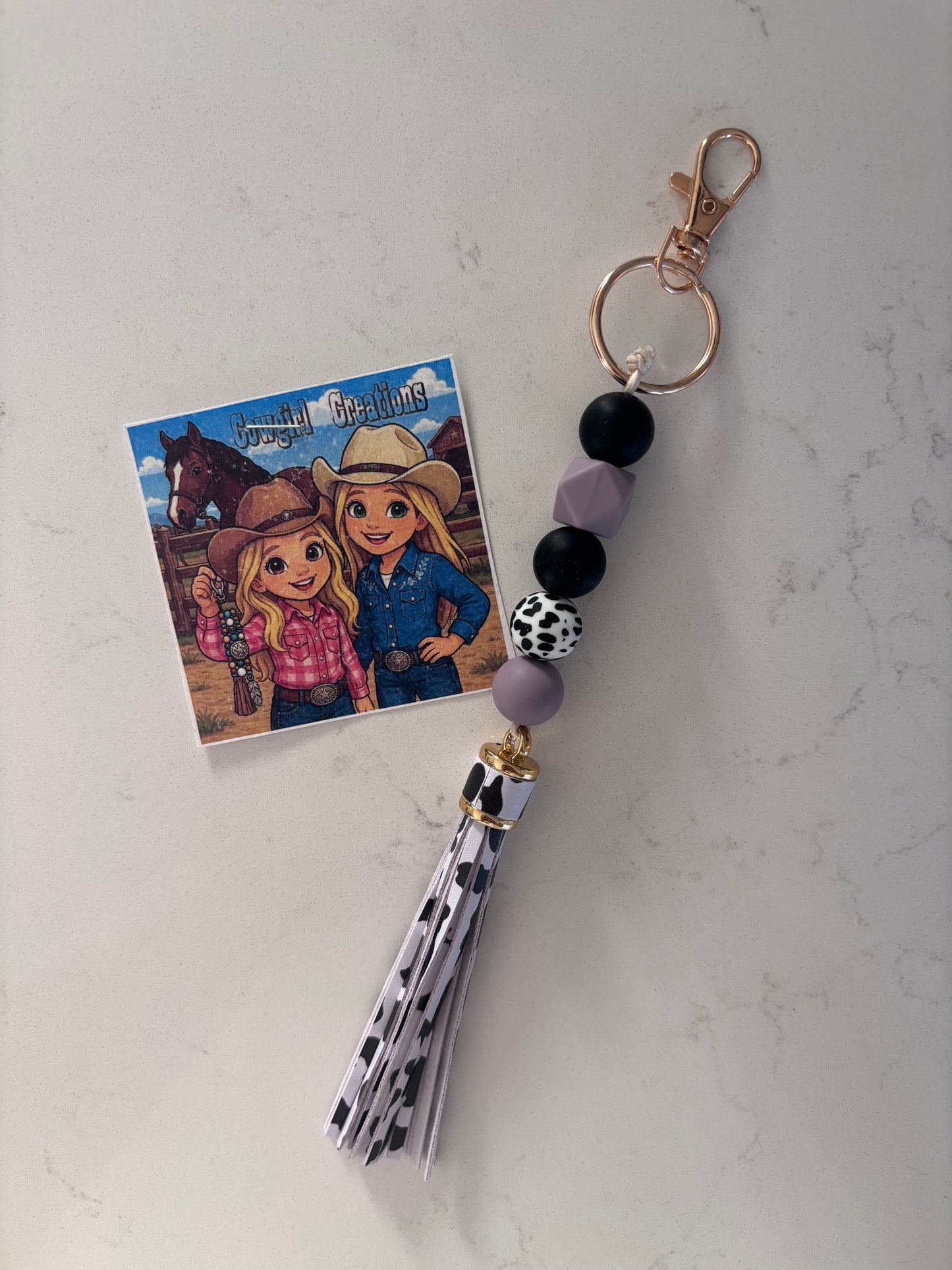 Cowgirl Creations Purple Cowprint Tassle Silicone Bead Keychain