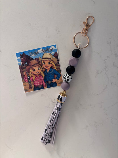 Cowgirl Creations Purple Cowprint Tassle Silicone Bead Keychain